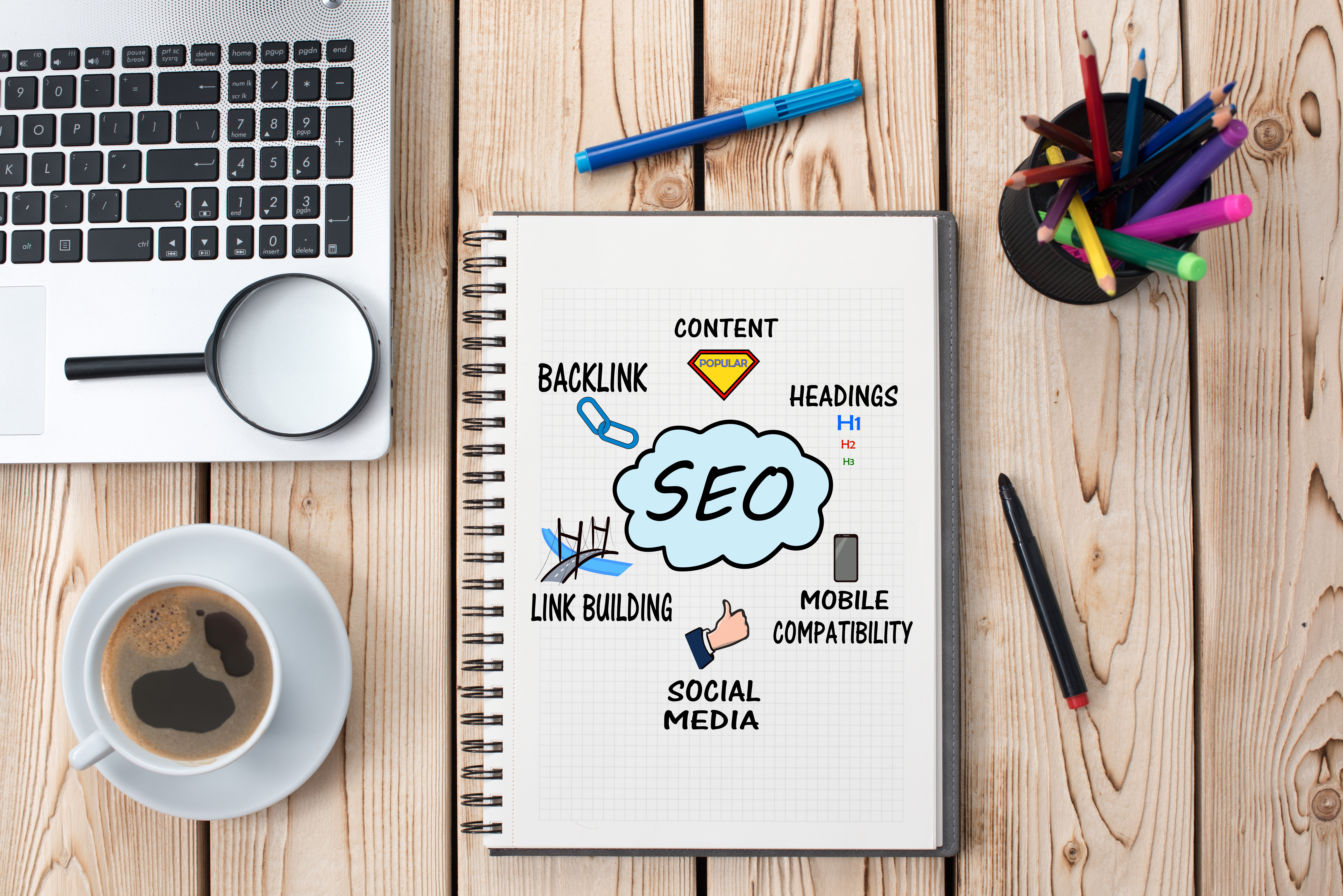 notebook on table that says seo